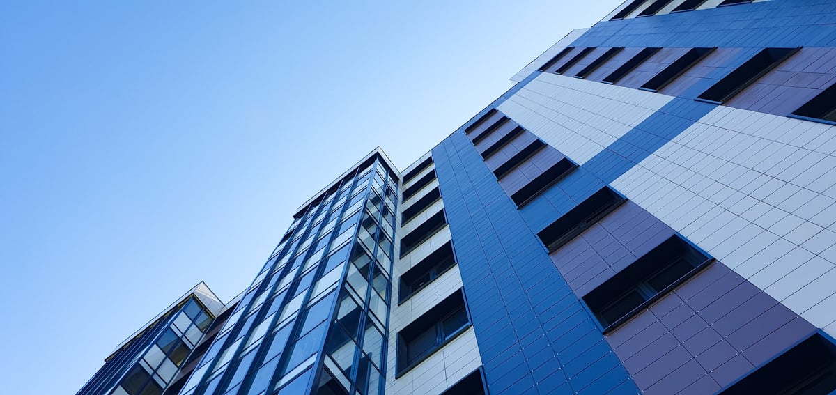 A residential apartment building from top to bottom. Commercial real estate, building. Buying, renting real estate. City apartments.
